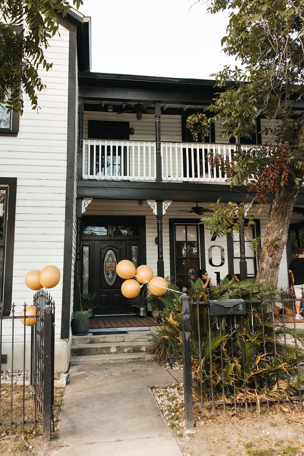 The outside of the house decorated with balloons