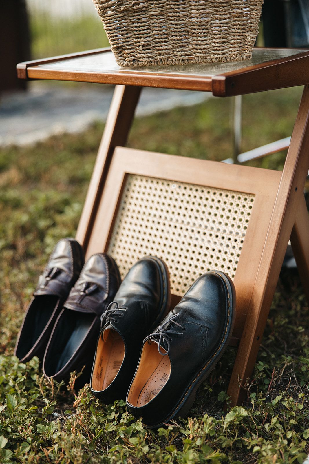 A pair of shoes displayed on a chair set on a rug